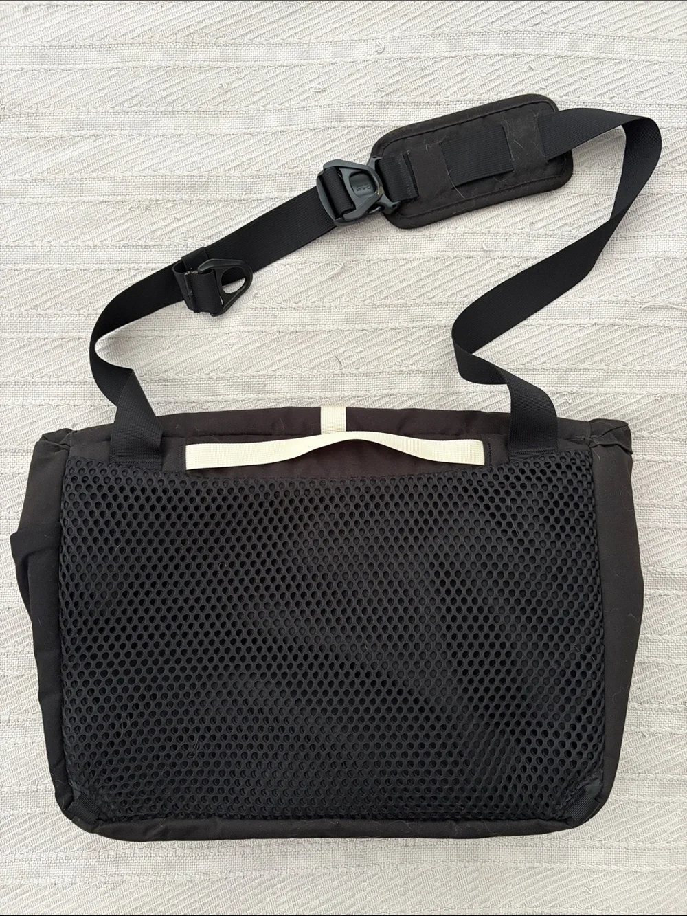 cotopaxi Black Messenger Bag with Cream Stripe